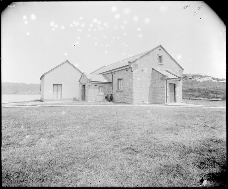 Photo shows Building 44 QF ammunition store constructed 1899; Building 43 Laboratory at left rear constructed 1877-78. Photo dated c. 1901